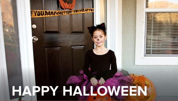 photo of a cute girl heading out the door to go Trick-or-Treating
