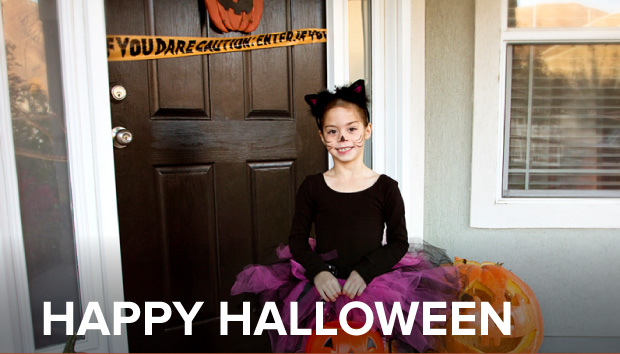 photo of a cute girl heading out the door to go Trick-or-Treating